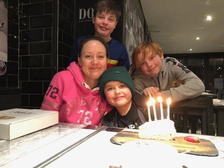 Sally Bundock with her three sons celebrating her youngest child birthday