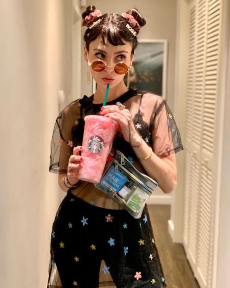 Alexandra Krosney is drinking a pinkdrink