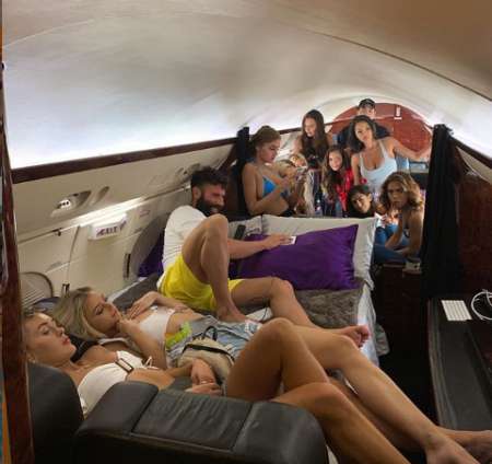 Dan on his private jet surrounded by beauties. Know more about Dan net worth, salary, income, earnings, house, prize money as well as many more as of 2019 