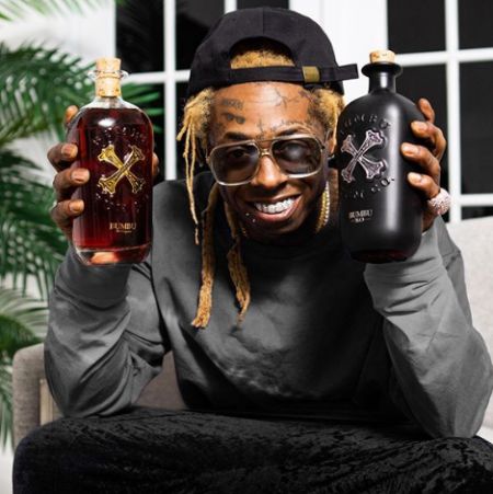 Lil branding harddrink Bumbu. know more about Lil Wayne net worth, salary, bank balance, remuneration, wages, and other sources of income.