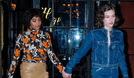 Amandla Stenberg and her girlfriend King Princess hold hands as they head to the MTV VMAs