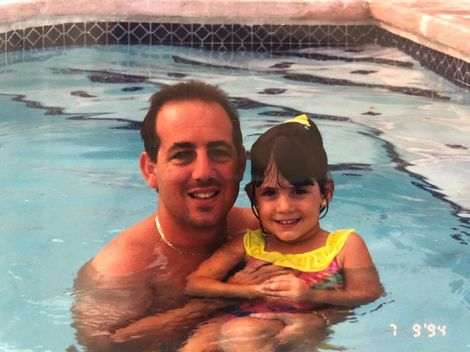 Caitlin Dechelle with her father in her early days