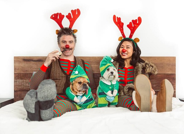 Anson Mount and Darah Trang with their pet dogs during Christmas