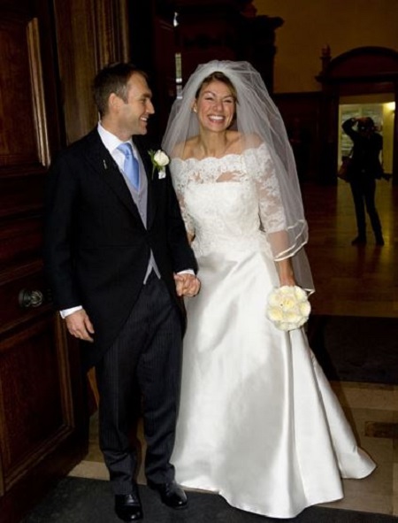 Kate Silverton poses with her husband Mike Heron on their big day.