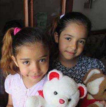  The image of Yvette and Michael's twin daughters Ysabel and Victoria Jordan.
