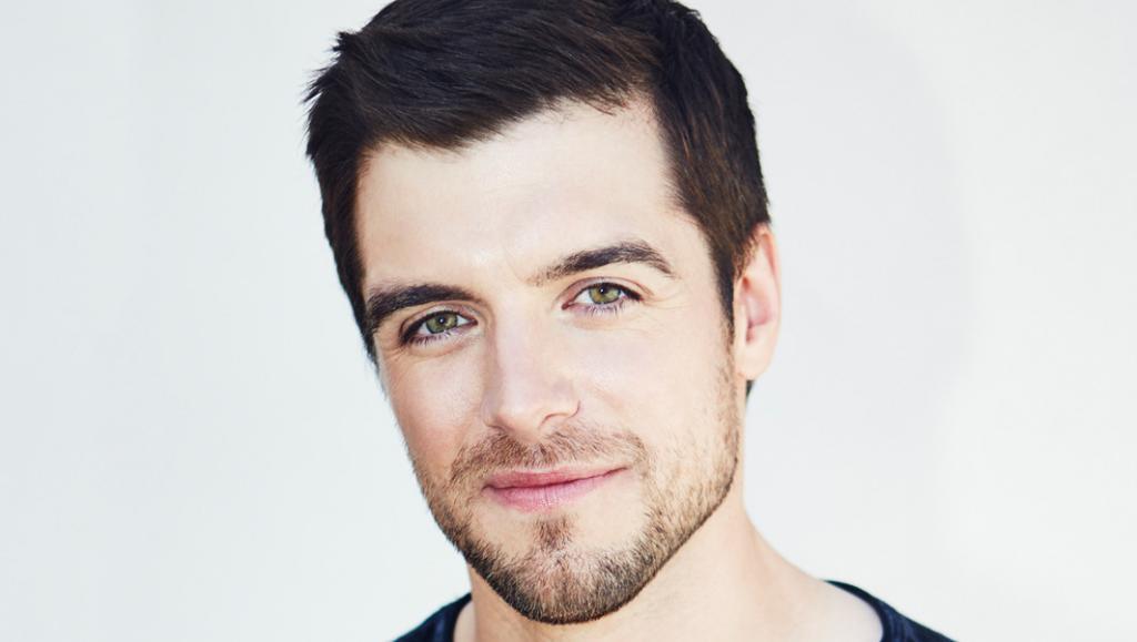 Dan Jeannotte  posing for a photo with a little smile in his face. 