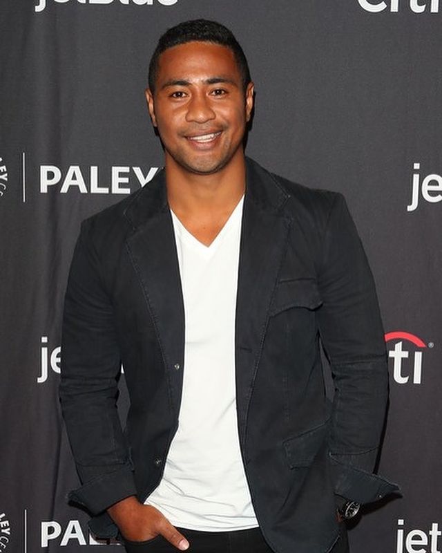 Picture of Beulah Koale posing for a photoshoot wearing black blazer and white color t shirt