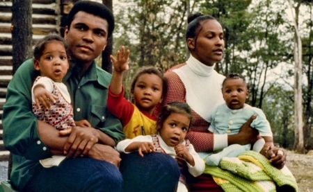 Maryum Ali sitting with her father alongside her siblings and mother, Khalilah Boyd