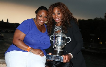 Serena Williams and her sister, Serena Williams poses with French Open Trophy