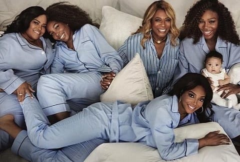 Oracene price posing for a photo with her children and grandchild