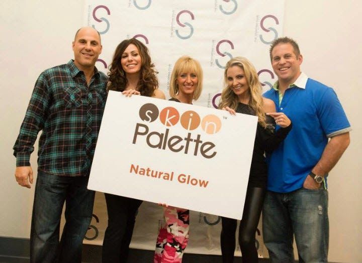 Julie Dorenbos and Susie Celek promoting their business with a board