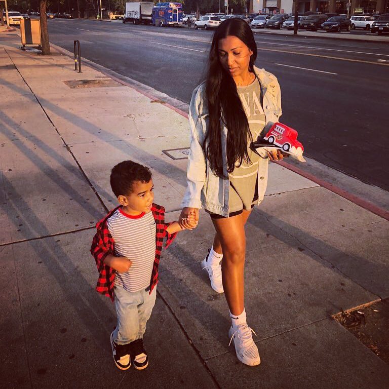 Melanie and her child walking