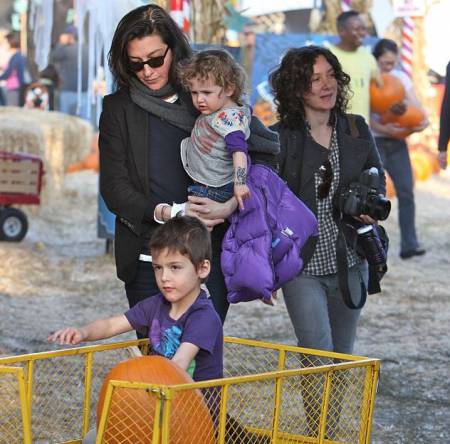 Sara Gilbert and Allison Adler with their children