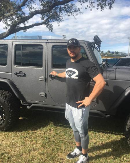 Kyle Schwarber standing with his car, Jeep Wrangler Rubicon