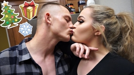Tyler and Loey Lane kissing each other during Christmas