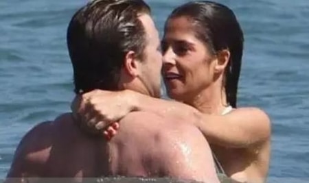 Kelly Monaco with Billy Miller swimming at the beach in Malibu