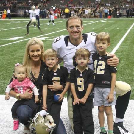 Brittany Brees and Drew Brees with their children
