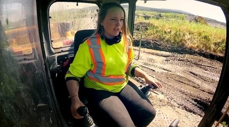 Monica Beets operating earth moving equipment during one of the episodes of Gold Rush