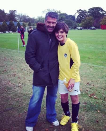 Alina's husband David with their son Max at a soccer match