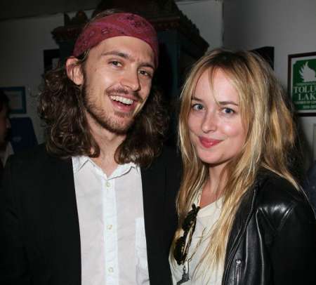 Dylan's step-brother, Alexander Bauer with Dakota Johnson at the premiere of No Way Around But Through