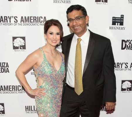 Dinesh D'Souza with his current spouse, Deborah Fancher at the premiere of Hillary's America in Los Angeles