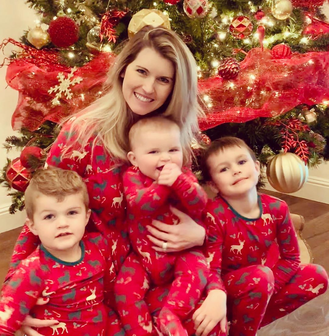 Heather and her three kids in red dress on Christmas