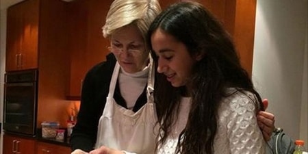 Elizabeth Warren with her grandchild at home cooking