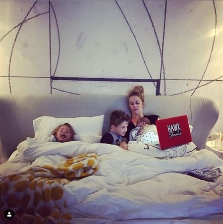 Candice Crawford telling story to her children during bedtime