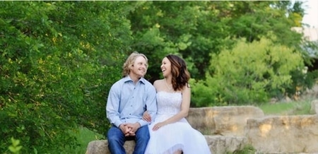 Cole Beasley and Kyrstin Beasley posing for photos after their wedding