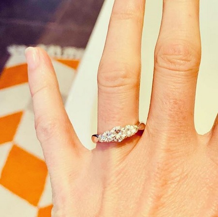 Jennifer showing her engagement ring