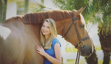 Siena posing with a horse