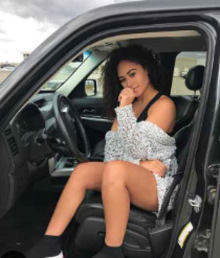 Maya posing while on a car, Net Worth & Earnings