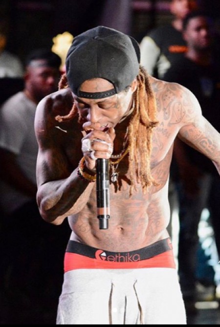 Lil on his stage performance. Know more about Lil Wayne songs, Lollipop, albums, concerts, and many more