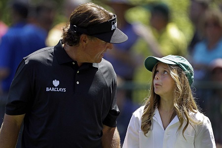 Sophia's father Phil talks with her during the Par 3 Contest 