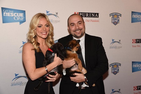 Peter Rosenberg with his wife and two dogs