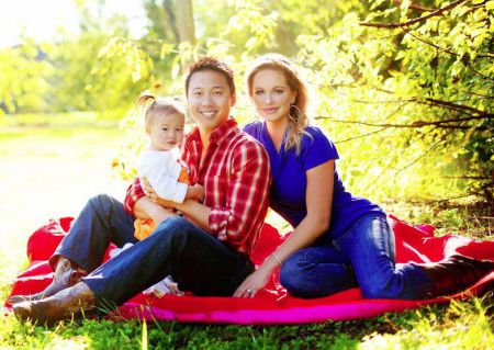 Image: Divini Rae and her husband, Winston Fong with their daughter