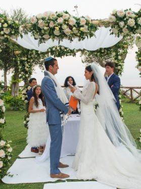 Anthony Westreich (left) and his wife Tanya Zuckerbrot (right) exchanging wedding vows in Capri, Italy