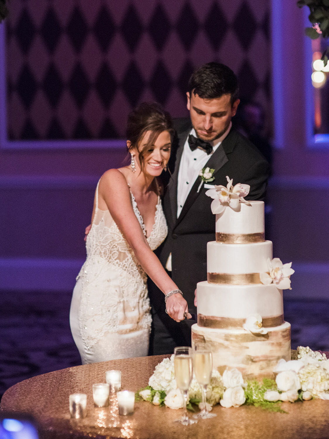 Jade Roper and Tanner Tolbert cutting their wedding cake at their reception