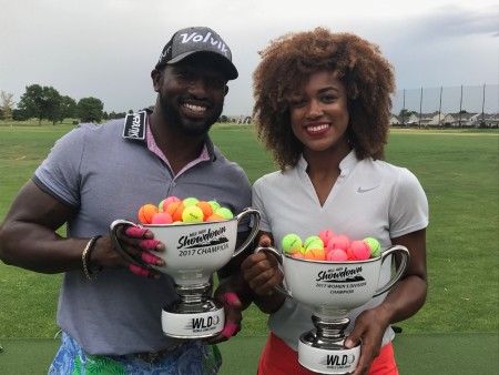 Troy Mullins is holding a World Long Drive Championship trophy with her friend