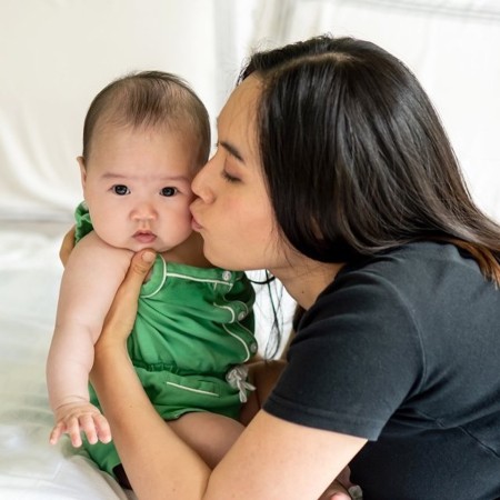 Carol E. Reiley with her newly born baby, Nova Athena Ng