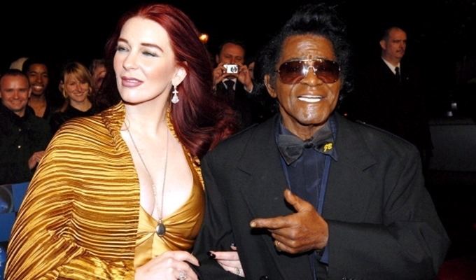 Tomi Hynie with her former spouse James Brown at an event