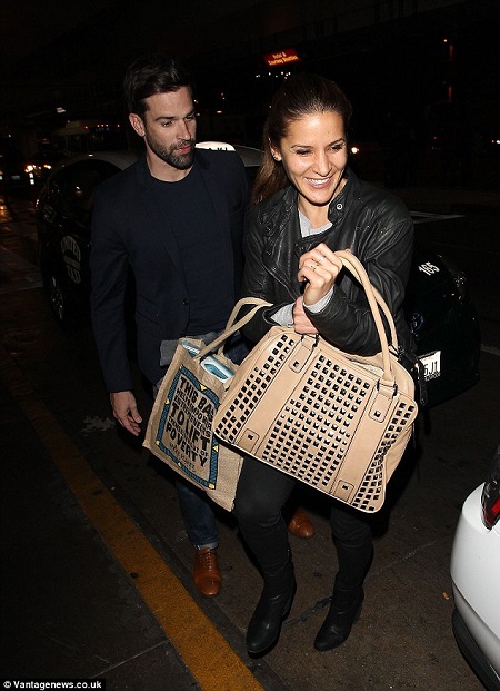 Gethin and Amanda, carrying bag full of groceries