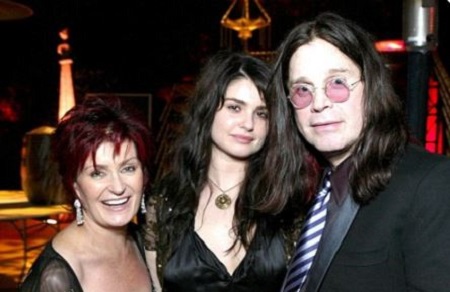 Aimee Osbourne with her father, Ozzy, and mother, Sharon at a music award. News depicts that they are no longer as close as they were before.