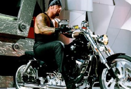 Sara's ex-husband The Undertaker in Harley Davidson during a game in WWE