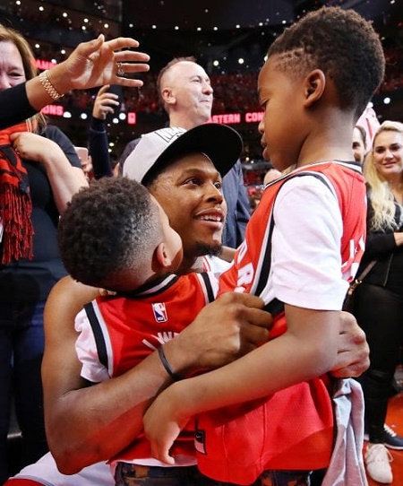 NBA star, Kyle Lowry with his two sons