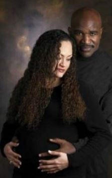 Evander Holyfield with his former wife Candi Calvana Smith posing for the photoshoot