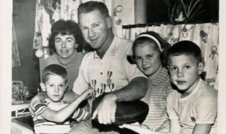 Joan Ford and Whitey Ford sitting with their three children