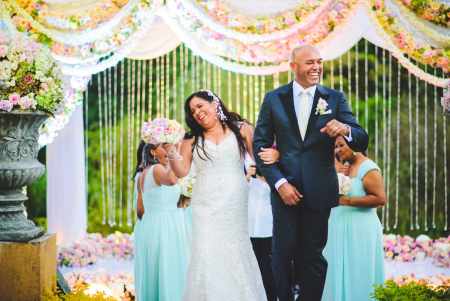 Clara Rivera and Mariano Rivera walked down the aisle with the smiling face