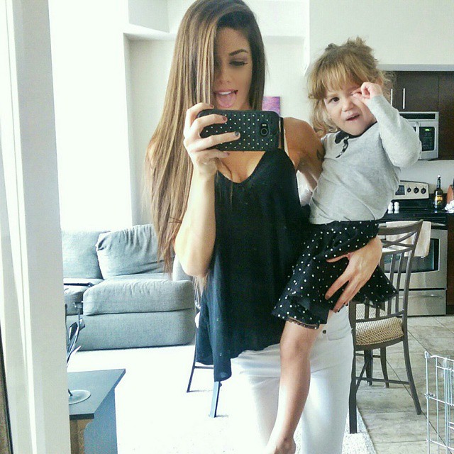 Juli clicking picture with her daughter, Kyli