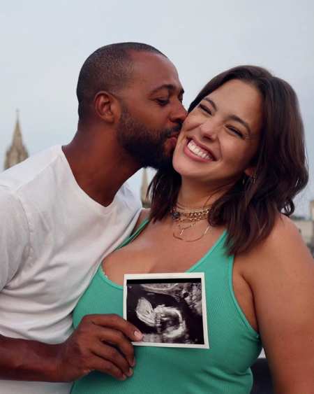 Ashley Graham and her husband Justin Ervin announced they're expecting a baby in their 9th marriage anniversary